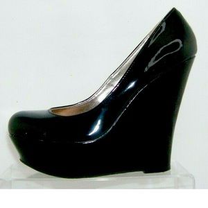Steve Madden 'Pammy' black man made round toe slip on platform heels.